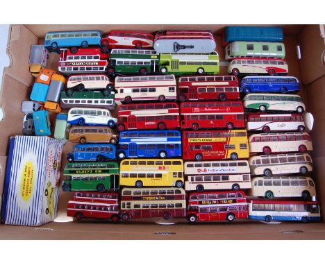 Two trays containing a quantity of various 1/76 scale white metal, resin and diecast public transport coaches and buses ,mixe