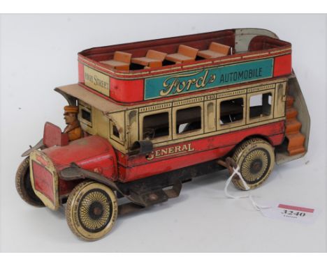 A Gunthermann of Germany 1930s tin plate and clockwork double decker bus, scarce example finished in red and white with tin p