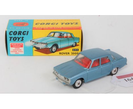 A Corgi Toys No. 252 Rover 2000 saloon comprising of metallic light blue body with red interior and spun hubs, in the origina