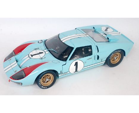 An Exoto Racing Legends model No. LMC10011 1/10 scale model of a 1966 Exoto Ford GT 40 Mk2, finished in light blue with gold 