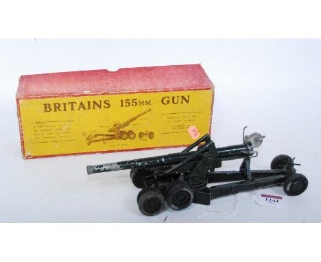 A Britains No. 2064 155mm field gun comprising of gun with shell case loader and six shells, complete with trail spades (miss