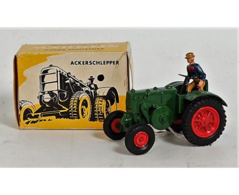 A Marklin No. 8029 Lanz agricultural tractor, finished in green with red hubs and driver figure housed in the original all-ca