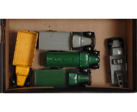 Five various loose and playworn Dinky Toys commercial vehicles to include No. 25A wagon finished in green and black, No. 25D 