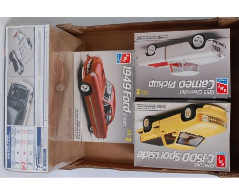 An AMT/ERTL and Revell boxed 1/25 scale 4x4 and Ford Classic car and pickup group to include a Chevrolet C1500 Sportside, a 1