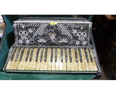 A Paulo Soprani piano accordion. Cased