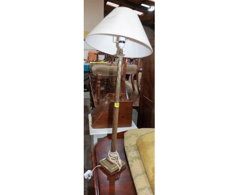 A brass Corinthian table lamp