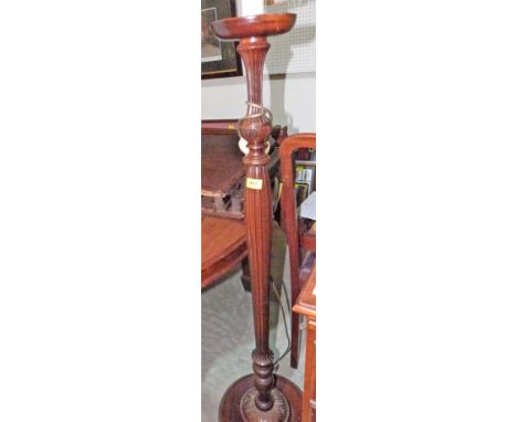 A mahogany reeded lamp standard