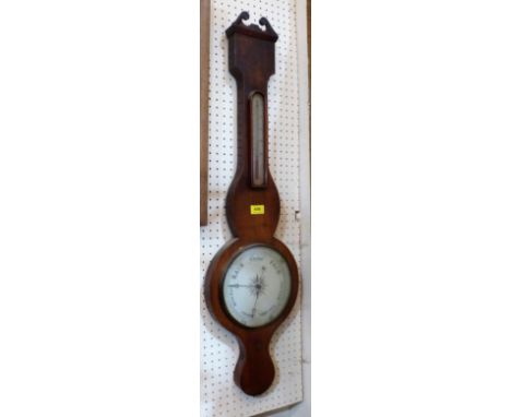A 19th century mahogany wheel barometer with silvered dial and temperature register. 38'' high