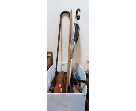 A collection of old wood planes and other tools