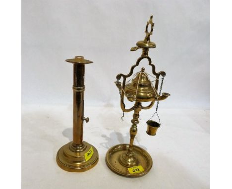 A brass ejector candlestick and a brass Roman style lamp