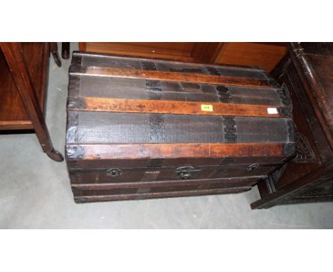 A 19th century dome topped canvas and wood braced cabin trunk. 30'' wide
