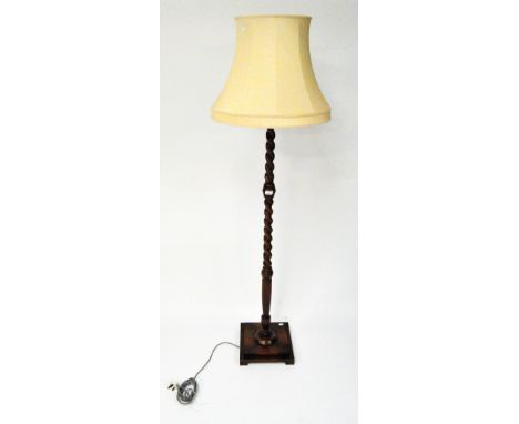 An early 20th century Oak barley twist standard lamp and shade, 177cm high including shade