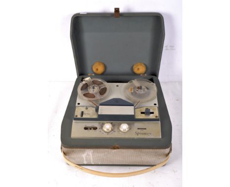A BSR (Monarch) Spinney reel to reel portable tape recorder, within a blue leatherette case with cream handle, 39cm x 18cm x 