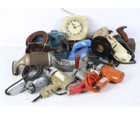 A box of tools including a Makita Power Plane, an Art Deco clock, a Vachic brush and other items 