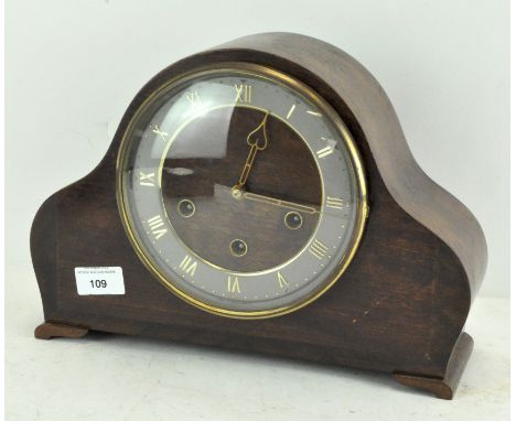 A 20th century mantel clock, with bevelled glass front, the silvered dial with Roman numerals and a silent/chime feature, wit