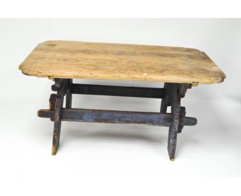 A vintage table with separate pine top with shaped corners, on a blue painted base with plugged stretchers, 63cm x 137cm x 85