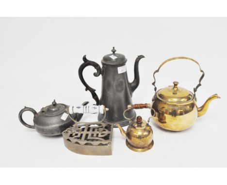 A selection of vintage pewter and brass teapots and kettles and an iron, up to 25cm high