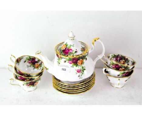 A Royal Albert 'Country Roses' six piece tea set, comprising tea cups, saucers and Teapot