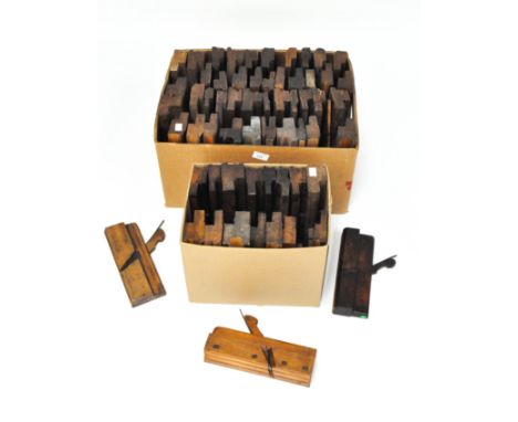 A selection of woodworking tools, comprising of seven jack planes, four wooden clamps and four ploughs, the majority with bra