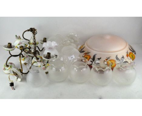 A three branch ceramic chandelier and corresponding pair of two light wall lights and a single, each encrusted with flowers; 