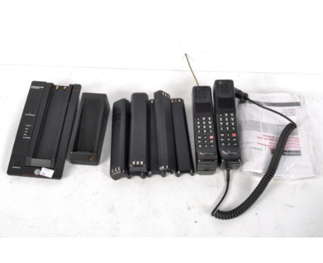 A collection of Motorola 8800X cellular portable telephones, together with a charging point and instruction manual