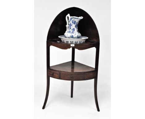 An oval corner wash stand with one drawer and two faux drawers, height 113cm, together with a blue and white stoneware wash b