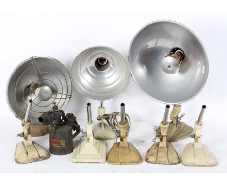 A box of heat lamps and heat lamp bases, including examples by Pifco and Ergon 