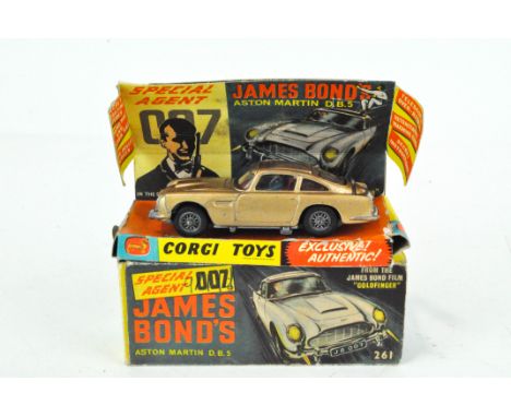 A Corgi Toys 261 Special Agent 007 James Bond's Aston Martin D.B.5. from the James Bond film "Goldfinger", gold body with red