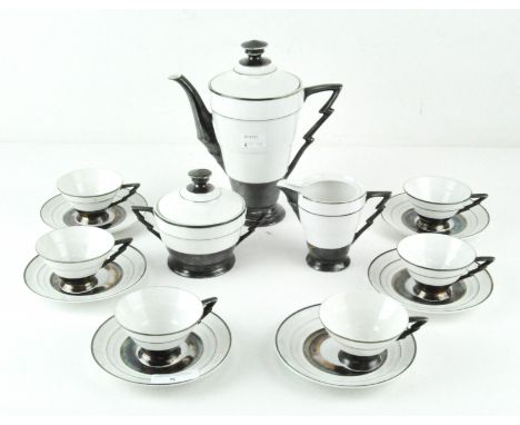 An Art Deco Sterling silver mounted porcelain tea set, with silver banded decoration of a white ground, comprising six cups a