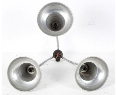 A vintage Ensign Universal Multiflood three-light lamp, with central bakelite switch issuing three adjustable branches and do