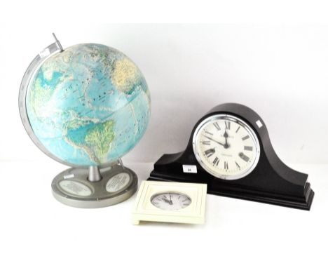 A contemporary table globe with a coloured printed paper cover, height 40cm, together with a battery powered clock in a white