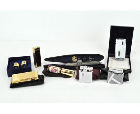 A selection of lighters, comprising a boxed Ronson Electronic Varaflame lighter, a Ronson Slimline Lighter engraved 'GRR', a 