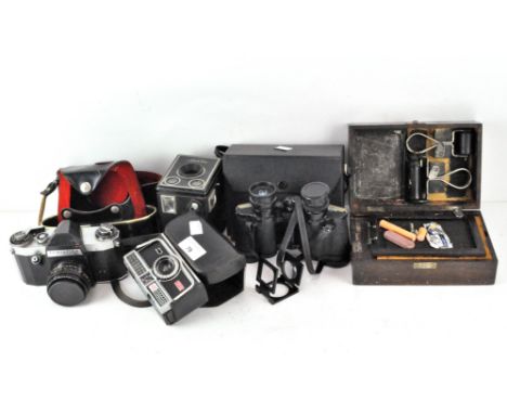 A collection of vintage cameras, including a Kodak Six-20 'Brownie' C, Kodak 304 and a Pentaflex SL, together with a pair of 