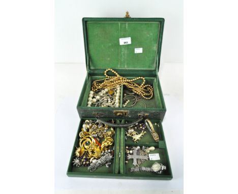 A collection of vintage costume jewellery including earrings, brooches and more, in a two tier jewellery box