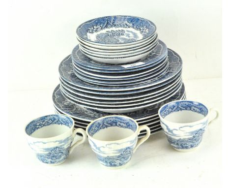 A Staffordshire part tea and dinner service in the 'Old Castle' pattern, comprising three cups, six saucers, side plates, din