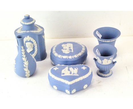 Six items of 20th Century Wedgwood Jasperware, in blue and white, comprising two lidded pots, a beaker, two vases and a tea c