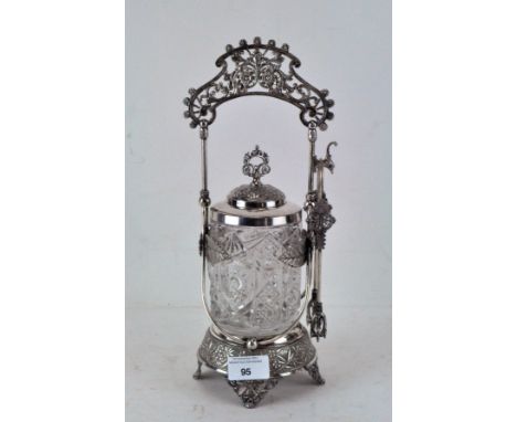 An early 20th Century moulded glass pickle jar, in a silver plated stand decorated with flowers and leaves by Meriden Britann