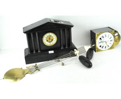 A late 19th century French Jules Rolez Ltd Paris black slate mantel clock with six columns flanking the gilt face, height 32c