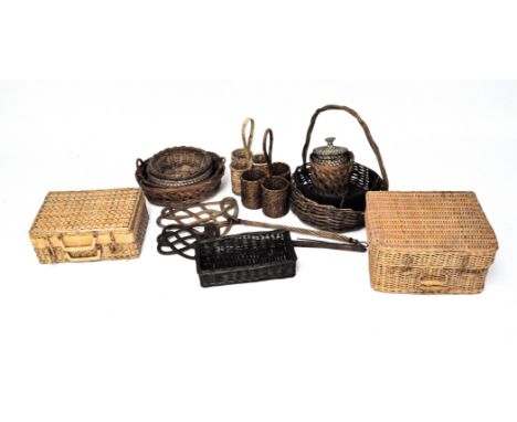 A large selection of vintage wicker baskets, of varying shapes and designs, including a bottle holder