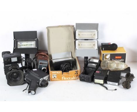A collection of cameras/cine cameras including a Polaroid 600 SE, a Polavision Land Camera, Flectalux flashes, and more