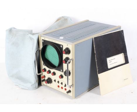 An Advance oscilloscope OS15, 17cm x 22cm x 38cm, with instruction manual and plastic cover