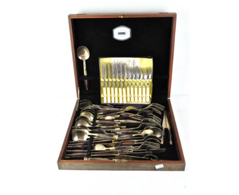 A vintage canteen of gilt finished cutlery, with wooden handles, together with a set of chrome plated fish cutlery