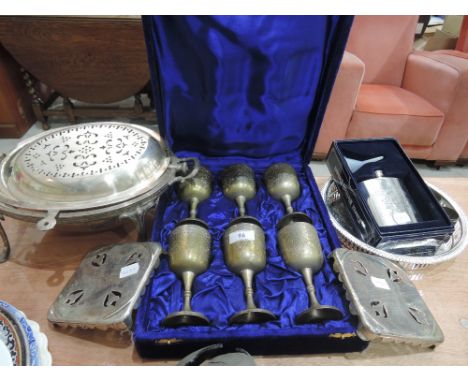 A selection of plated ware including goblets, trivets, spirit flask etc