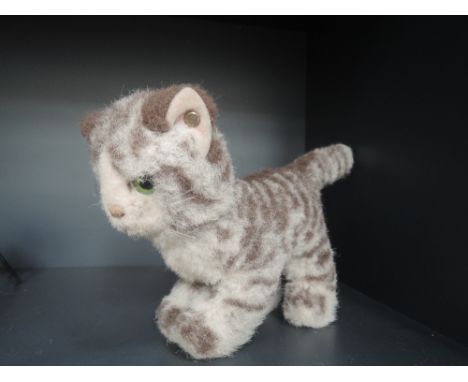 A modern Steiff kitten having silver button in ear