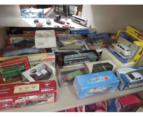 A shelf of mixed die-casts including Corgi, EFE, Matchbox etc, all boxed