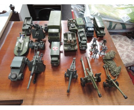 A selection of Dinky and similar die-cast military vehicles, field guns and plastic figures