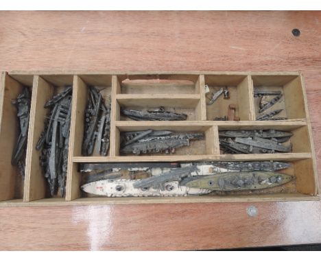 A box of pre-war Dinky and Bassett Lowke lead ships (approximately 40)