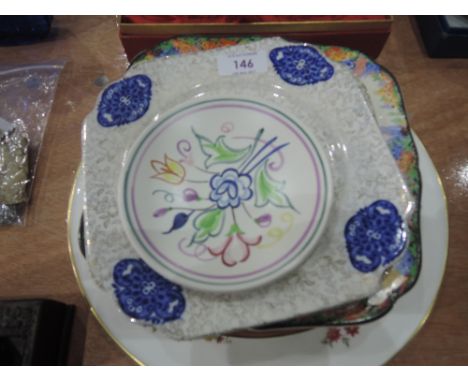 A selection of decorative plates including Poole