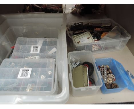 A shelf of mixed vintage Meccano accessories