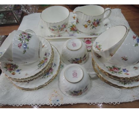 A Minton 'Marlow' part tea service (22 pieces approx) and embroidered tablecloth